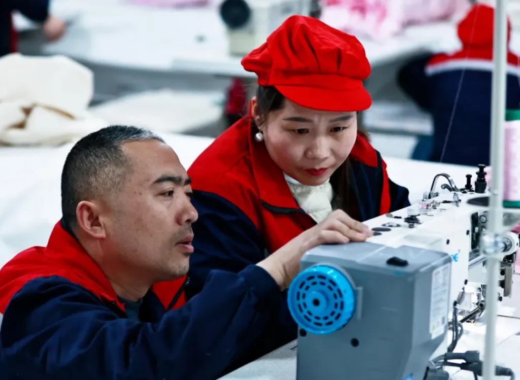 Workers are checking the machine settings